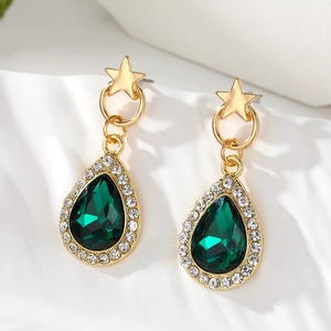 Elegant gold-tone star drop earrings with emerald green crystal and pavé border