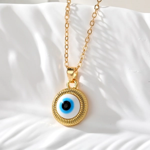 Collier avec pendentif œil maléfique rond rétro doré avec breloque œil turc bleu