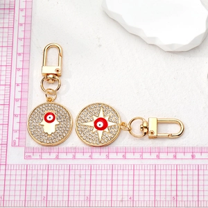 Vintage gold alloy evil eye keychains with hamsa hand and octagonal star pendants