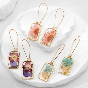 Three pairs of square resin earrings with real dried flowers and gold foil accents