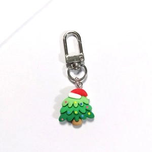 Cute mini green Christmas tree resin keychain with festive red hat and metal clasp