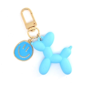 Portachiavi cane a palloncino blu opaco con charm faccina blu e gancio in metallo dorato
