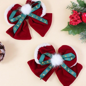Weihnachts-Haarspangen aus rotem Samt mit weißen Plüschkugeln und festlichen Goldbändern