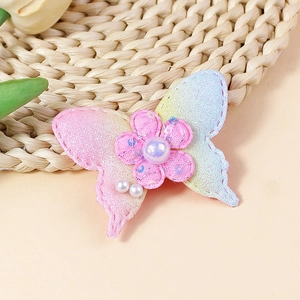 Handmade gradient fabric butterfly accessory with colorful glitter, sequins, and pearls