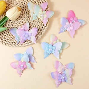 Set of six colorful iridescent fabric butterfly appliques with pearls for DIY crafts