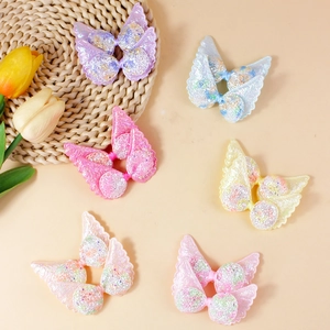 Sparkly sequin butterfly wing hair accessories in assorted macaron pastel colors