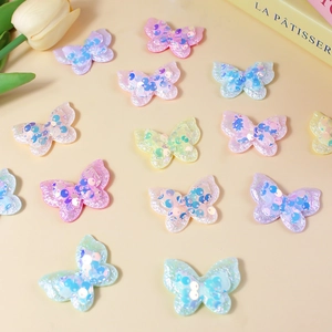 Colorful sequin butterfly patches for DIY hair accessories and craft projects in pastel colors