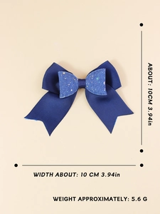 Detail showing 10cm navy blue glitter bow hair clip with ribbed ribbon and 5.6g weight info