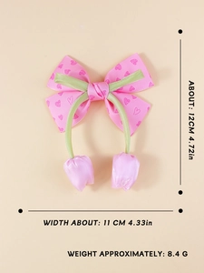 Detail view of pink heart ribbon hair clip with tulip charm showing 12x11cm dimensions