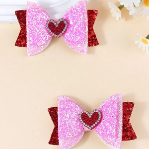 Fermagli per capelli con fiocco glitterato rosa e rosso con cuore di strass