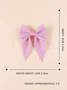 Pink fabric bow hair clip with rhinestones and detailed size dimensions in centimeters