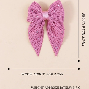 Pink rhinestone bow hair clip with knitted texture and delicate mesh fabric details