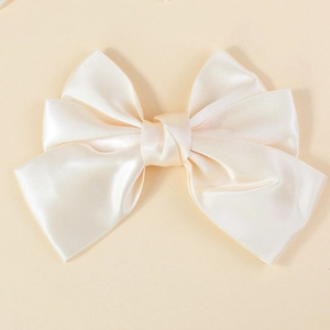 Elegant oversized cream satin bow hair clip for women with a smooth silky texture finish