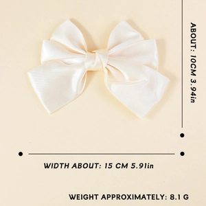 Elegant oversized cream satin bow hair clip for women with smooth glossy finish