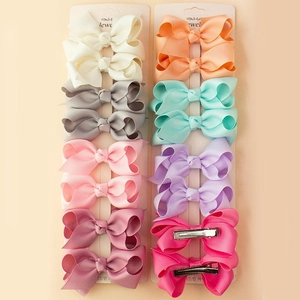 Détail du lot de 10 barrettes à cheveux multicolores en ruban gros-grain pour filles