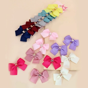 Set of colorful ribbed grosgrain ribbon bow hair clips with gold metal buckle accents