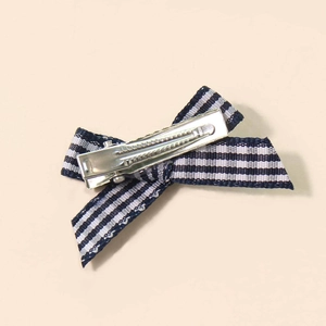 Classic navy and white striped ribbon bow hair clip with a silver metal alligator clasp