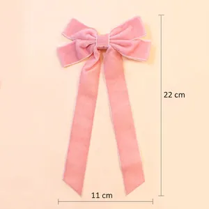Pink velvet long tail bow hair clip 22cm x 11cm with delicate white stitched edges