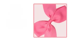Close-up showing the premium ribbed texture and fine stitching of the pink bow hair clip