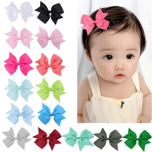 Multicolor grosgrain ribbon bow hair clips set for kids shown on model and in a grid