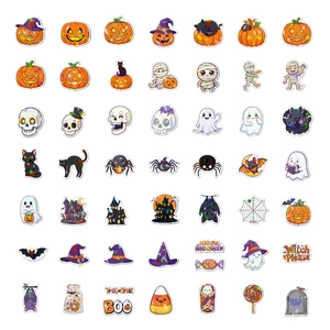 Macro shot of laser-effect Halloween stickers with pumpkins, ghosts and skulls designs