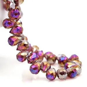 Macro view of faceted AB crystal glass beads with iridescent purple and gold coating