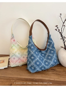Detailed star-patterned denim tote bag on a wooden table with lifestyle decor
