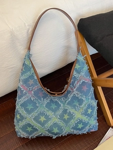 Denim Hobo tote bag with star prints, frayed edges, and leather shoulder straps for daily use