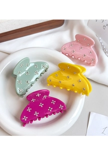 Elegant candy-colored acetate hair claws decorated with sparkling rhinestone flowers.