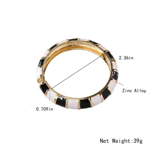 Bohemian enamel bangle in gold finish with geometric patterns and marble texture details