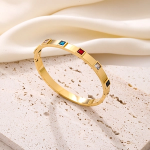 Polished gold titanium steel bangle with five square-cut multicolored zircon stones