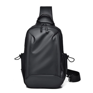 Close-up of black crossbody bag with matte fabric, dual zippers and drawcord side pockets