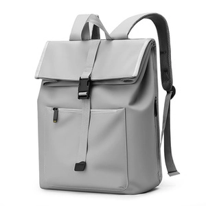 Detail view of grey flap crossbody bag with matte waterproof fabric and black plastic buckle
