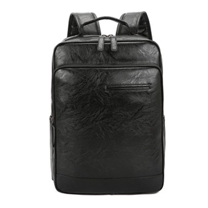 Detailed macro view showing the textured black PU leather and metal zipper on the backpack