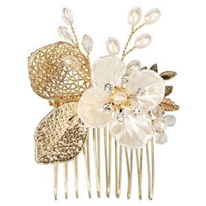 Exquisite bridal hair comb with gold metallic leaves, pearls, and a large white flower