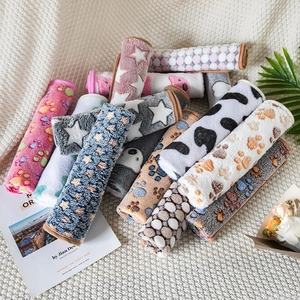Soft flannel pet blankets with cute paw prints and star patterns for cats and dogs