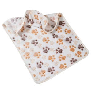 Soft coral fleece pet blanket with brown and orange paw prints for dogs and cats