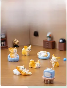 Miniature resin fennec fox figurines in various poses with cozy home decor accessories
