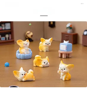 Miniature resin fox figurines set with tiny orange sofa and blue TV toy models
