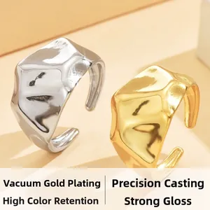 Detail of chunky gold and silver irregular textured rings with vacuum plating finish