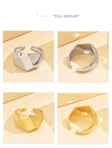 Detail view of irregular textured gold and silver open rings with high-polish metallic finish