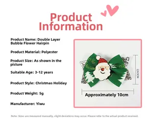 Detail of Christmas bow hair clip with Santa motif and green fir tree pattern