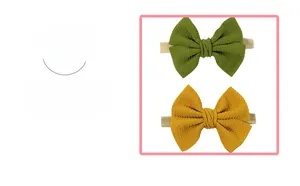 Detail of two nylon baby headbands with soft plaid bows in green and yellow
