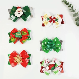 Set of 6 Christmas themed bow hair clips with Santa, snowflake and tree motifs