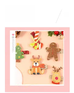 Detail of Christmas kids hair clips set with snowflake glitter bows and reindeer designs