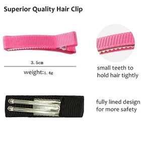 Pink and black ribbon hair clips with fully lined design and small teeth for extra grip