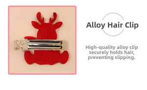 Detail view of red reindeer hair clip with gold glitter and alloy duckbill clip back
