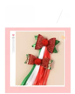 Detail of Christmas bow hair clips with red glitter, pom-poms and colorful wig hair extensions
