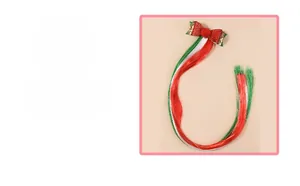 Detailed Christmas hair bow with sequins, pom-poms and colorful synthetic hair strands