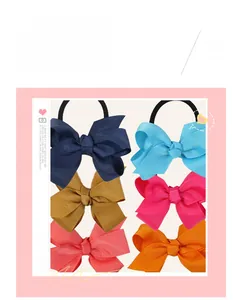 Detailed close-up of colorful ribbed grosgrain ribbon bow hair ties in six vibrant shades